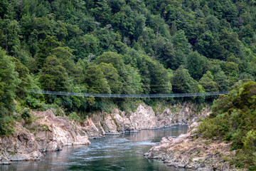 Fototapeta na wymiar NZ longest swingbridge over the Buller Gorge in New Zealand