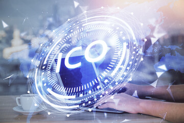 Double exposure of woman hands typing on computer and crypto market theme hologram drawing....