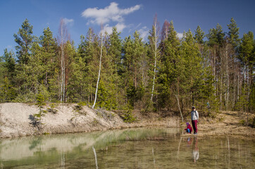 Fototapeta na wymiar View of small green blue Lackroga lake, Latvia