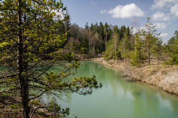 Obraz premium View of small green blue Lackroga lake, Latvia