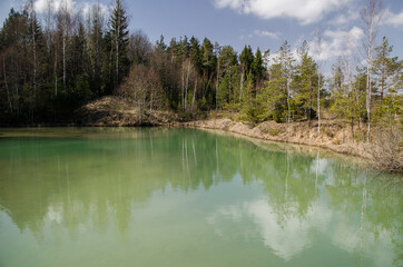 View of small green blue Lackroga lake, Latvia