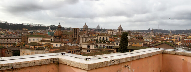 Rome panorama, domes, churches, roofs and cloudy sky