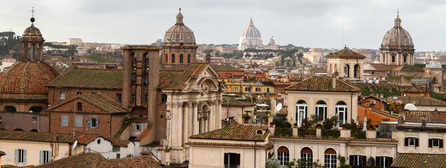 Rome panorama, domes, churches, roofs and cloudy sky