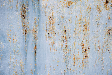 Rusty old metal texture with remnants of the paint. Grungy background for any design. 