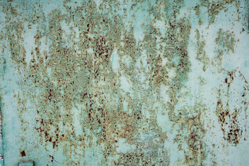 Rusty old metal texture with remnants of the paint. Grungy background for any design. 