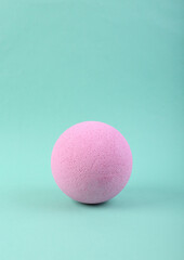 Pink ball on a blue background. Minimalism.
