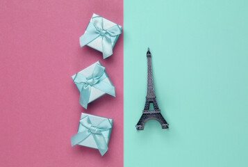 gift boxes with bows and a statuette of the Eiffel Tower