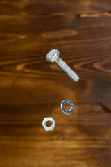 falling screw, washer and nut on blurred background - 427245379