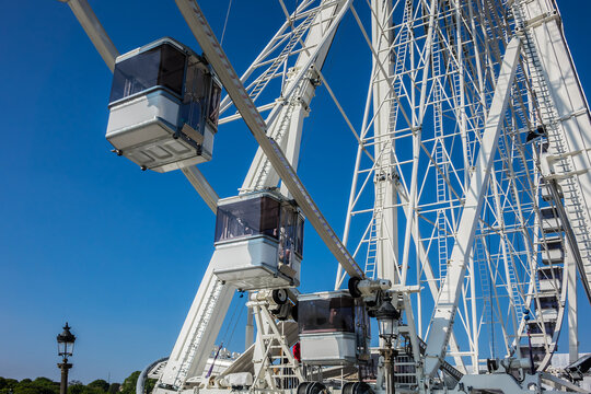 View of Ferris wheel in Paris. The giant Ferris wheel (Grande Roue) set up on Place de la Concorde, between Obelisque and the Jardin des Tuileries. PARIS, FRANCE. April 8, 2017