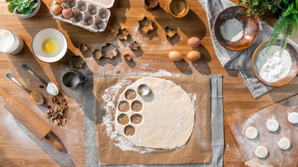 Flat lay top view of dough and baking ingredients, desktop concept.