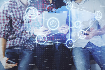 Double exposure of social network theme drawing and man and woman working together holding and using a mobile device.