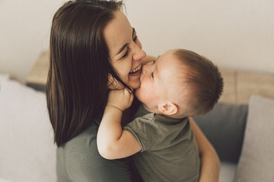 Happy loving family. Mom and his son are hug at home. Mother's day.