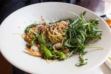 delicious fresh italian pasta with fish and rucola salad.