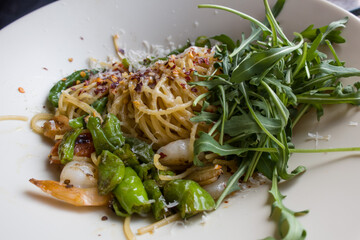 delicious fresh italian pasta with fish and rucola salad.