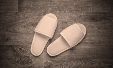 White slippers on the floor. Top view