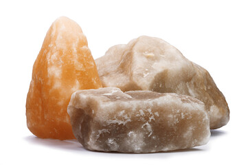three large pieces of natural salt on a white isolated background