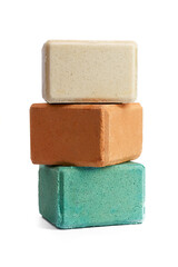 three large pieces of natural salt in briquettes on a white isolated background