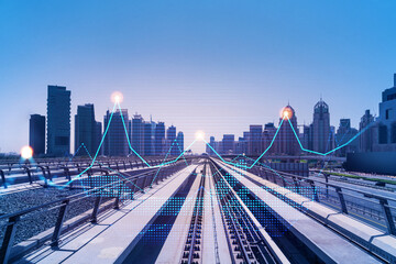 The way towards skyscrapers by modern futuristic train. Tech railway delivers commuters to the financial downtown of Dubai. International business hub. Traffic concept. FOREX graph. Double exposure