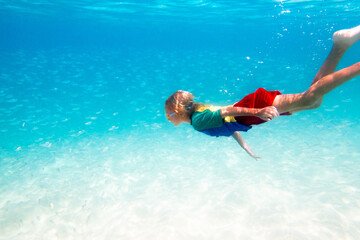 Child snorkeling. Kids underwater. Beach and sea.