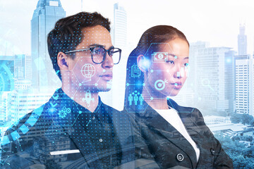 Two colleagues in multinational corporate team thinking about career opportunities at research and development department at international consulting company. Hologram icons over Kuala Lumpur.