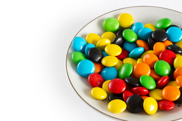 Rainbow-colored candies, multicolored close-up, texture, background.