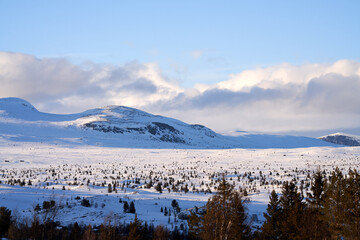 Landscape of the winter mountains in Ål, Hallingdal, Norway. Shot in April in the evening. Summer is coming, but the snow is still covering the mountains. 