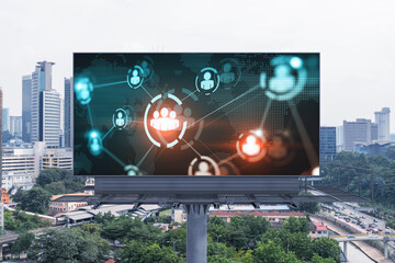World planet Earth map hologram and social media icons on billboard over panorama city view of Kuala Lumpur, Malaysia, Asia. The concept of people networking and connections.