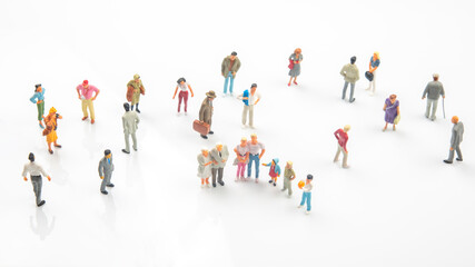 miniature people. different people stand on a white background. communication of society of...