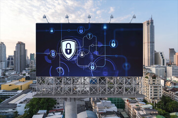 Padlock icon hologram on road billboard over panorama city view of Bangkok at sunset to protect...