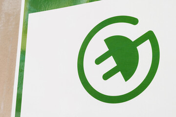green Electric Vehicle Recharge Point Sign. A green sign of a power supply for electric cars.