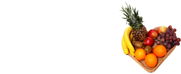 Basket with tropical fruits isolated on white background.