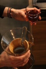 Fototapeta na wymiar hand holding a cup of coffee