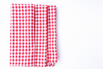 Top view red and white fabric checkered tablecloths neatly folded isolated on white background with copy space.