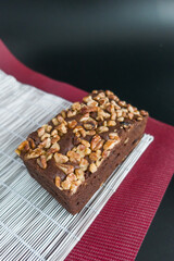 Brownies with walnut on the black background.