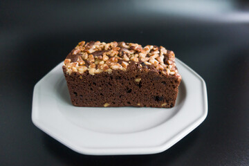 Fototapeta na wymiar Brownies with walnut on the black background.