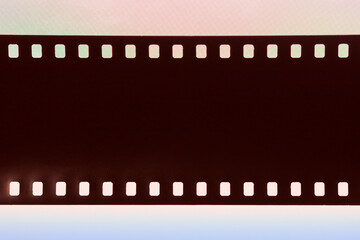 Fototapeta premium Abstract film texture with dust and scratche on colorful background. Photo, movie, cinema concept, copy space