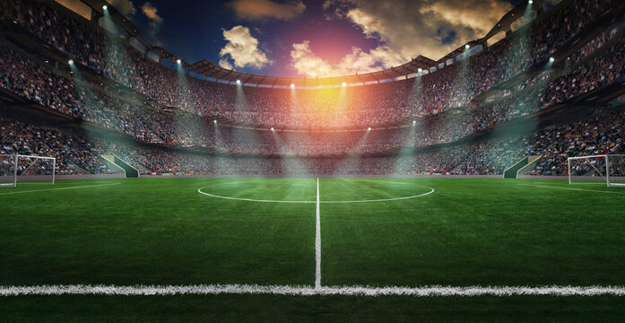 Football lies in the smoke on stadium grass