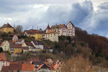 Fototapeta na wymiar medieval castle on top of the mountain against overcast sky