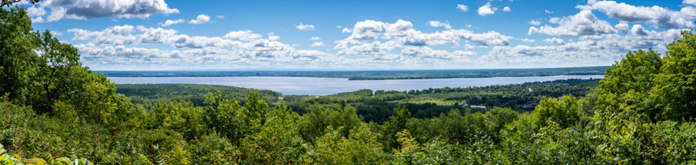 Fototapeta na wymiar Panoramic view of Lac des Deux Montagnes during a beautiful sunny day in Quebec, Canada