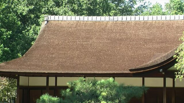 Side view of a hinoki bark roof on a Japanese house.