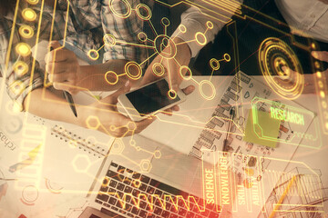 Double exposure of data theme hologram drawing and man and woman working together holding and using a mobile device.
