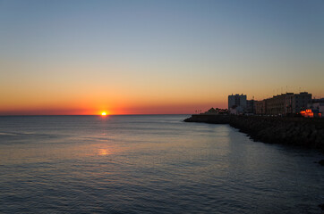 Fototapeta na wymiar Sunset over the sea in Cadiz, Spain