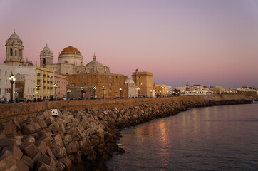 View on Cathedral in Cadiz and promenade in sunset and seascape, Spain © Natalia