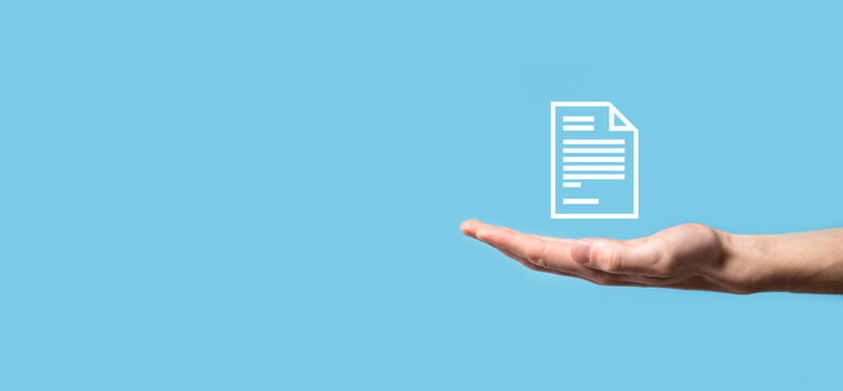 Male hand holding a document icon on blue background. Document Management Data System Business Internet Technology Concept. Corporate data management system DMS