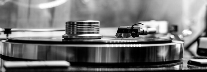 vinyl record player close up, black and white photo