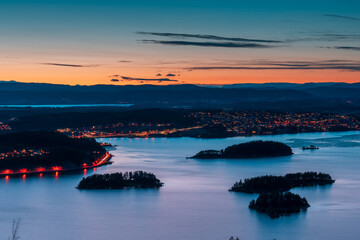 Sunset over Steinsfjorden, a branch of Lake Tyrifjorden located in Buskerud, Norway. View from Kongens Utsikt (Royal View) at Krokkleiva