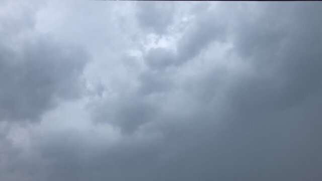 Dramatic sky with dark stormy clouds, fluffy clouds.