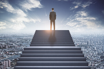 Success concept with businessman back on the top of stairway on megapolis city background