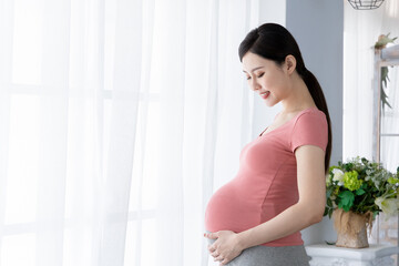 Side view of asian pregnant woman