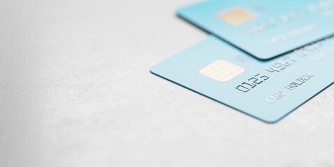 Online shopping concept with blue credit cards on abstract light surface with copyspace, 3D...